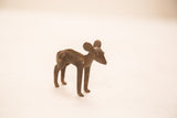 A side profile view of the handmade bronze impala showing its dark textured patina.