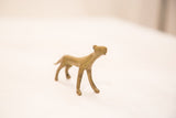 Stylized form and striding pose of a vintage African bronze cheetah.