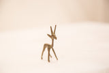 Handmade bronze gazelle gold weight with slender form and subtle patina.
