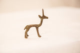 Vintage bronze gazelle statue in side profile, showing subtle oxidized patina.