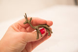 Vintage small bronze gazelle statue, showcasing its handmade texture and subtle patina.