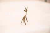 Vintage bronze gazelle gold weight from rear, highlighting slender form and aged patina.