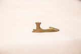 Vintage bronze resting cheetah sculpture, a side view showcasing its aged patina.
