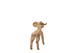 View from behind the vintage bronze ram, showing its curled horn and oxidized patina.
