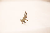 Vintage bronze rabbit figurine with aged surface texture and blue-green patina.
