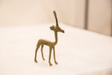 Handmade bronze gazelle gold weight showing graceful form and green patina.