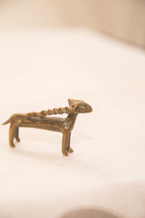 Intricate detailing, warm bronze patina, and visible broken horn on the antique antelope.