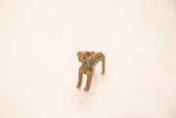 Antique African antelope sculpture with metallic bronze patina and intricate surface texture.