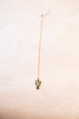 Vintage African frog pendant necklace shown at full length with its delicate copper-colored chain.