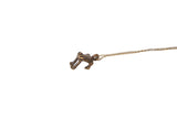 Vintage African frog pendant necklace with a dark, textured patina on a fine chain.