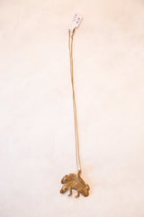 Vintage African chameleon pendant necklace shown at its full hanging length.