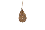 Vintage African teardrop pendant necklace with a bronze patina and geometric details.
