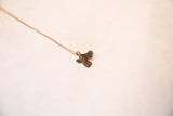 Vintage fish pendant necklace with a bronze patina, displaying the full length of its chain.