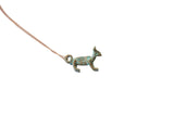 Vintage African fox pendant necklace with a distinctive blue oxidized patina.