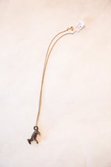 Close-up of the handmade African fox pendant with dark bronze patina.