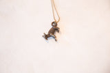 Handmade vintage African fox pendant, showing its dark bronze patina and intricate texture.