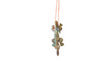 Vintage African crocodile pendant with a textured, oxidized patina on a thin copper chain.