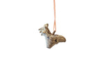 Vintage African rooster pendant with textured details and a blue-green oxidized patina on a chain.