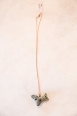 Full view of the vintage African rooster pendant necklace hanging from its delicate chain.