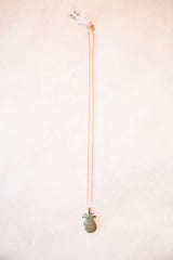 Vintage African necklace featuring a handmade pineapple pendant with rich patina.