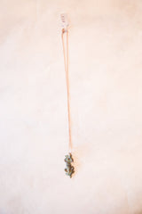 Full length view of the vintage lizard pendant necklace hanging straight down.