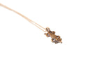 Vintage African lizard pendant necklace with a textured body and dark bronze patina.