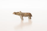 Side profile of a vintage African bronze hippo showing its simple, stylized form.