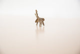 Vintage handmade bronze elephant sculpture, trunk raised, showcasing rich patina.