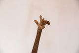 Rustic, handmade texture on the sculpted head of a vintage African bronze giraffe.