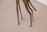 Hand-formed legs and delicate feet of the vintage African bronze giraffe sculpture.