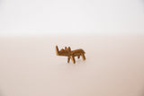 Vintage miniature golden bronze rhinoceros sculpture with handmade details from the side.