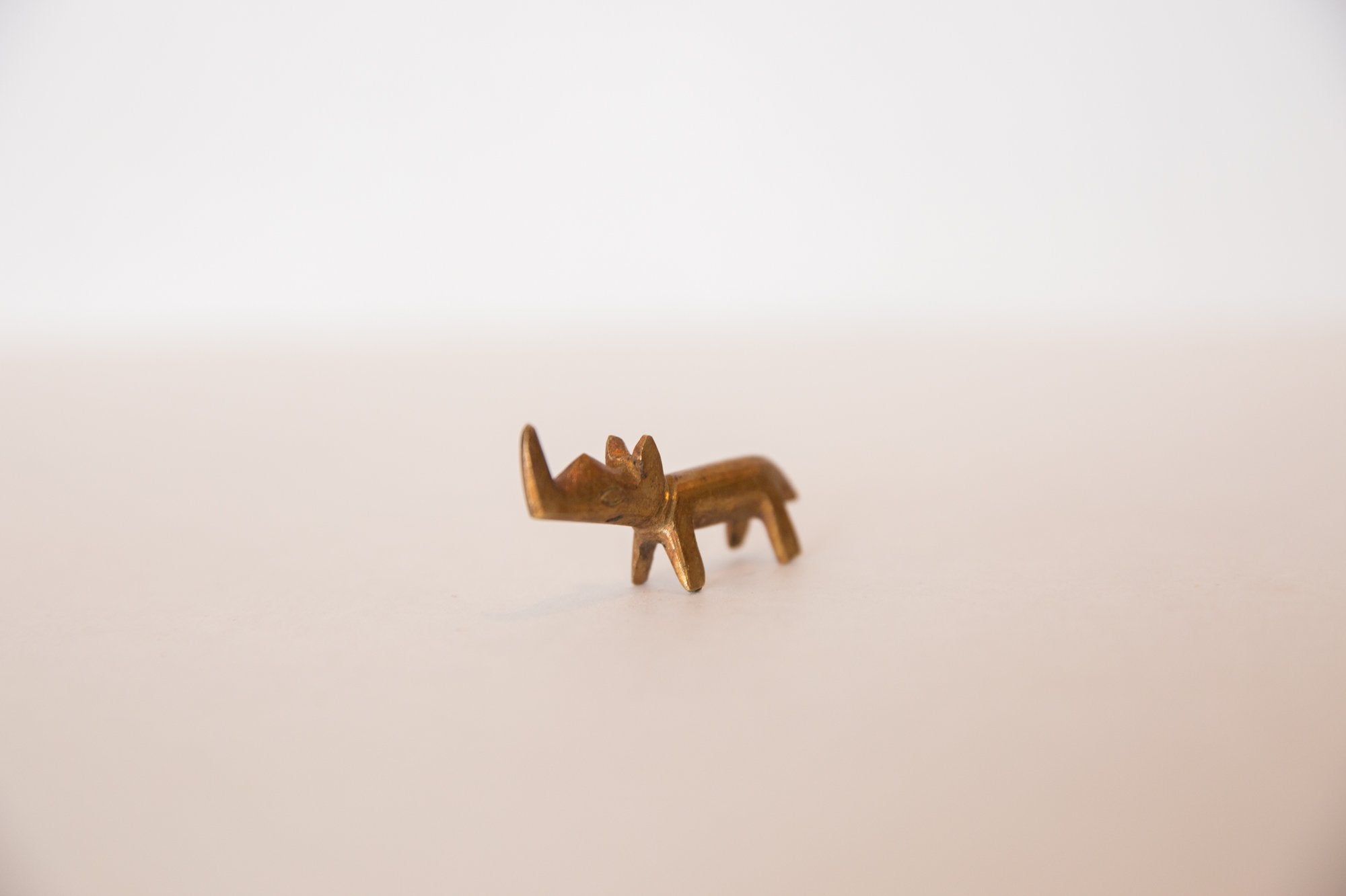 Vintage African Miniature Golden Bronze Rhinoceros Figurine Image 1