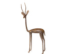 Handcrafted vintage African bronze gazelle sculpture facing left, with an aged patina.