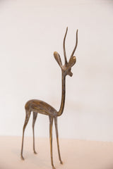 Vintage bronze gazelle sculpture with slender form and handmade, time-softened patina.