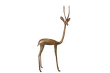 Vintage African handmade bronze gazelle sculpture, tall, elegant, right facing, with patina.