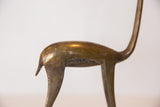 Handmade bronze gazelle with aged patina and warm tones on its textured back.