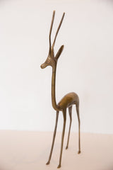 Handcrafted bronze gazelle sculpture showcasing its slender form and rich patina.