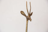 Close-up of the vintage handmade bronze gazelle's head, showing textured horns and patina.