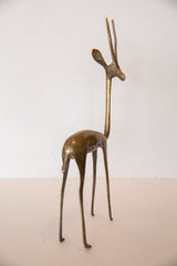 Collectible handmade bronze gazelle sculpture facing right, with aged patina.