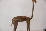 Vintage African bronze gazelle sculpture with a rich, time-softened patina and handmade texture.