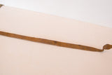 Vintage African iron snake sculpture displaying its flat body and rustic patina.