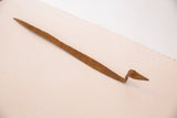 Textured, vintage iron snake sculpture with rich, rust-brown patina.