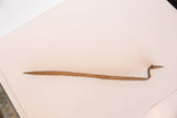 Handmade vintage iron flat snake sculpture, displaying its slender, rustic, textured body.