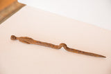 Vintage handmade iron stake figure displaying rustic texture and patina.