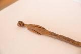Vintage African iron stake figure with textured, rust-patinaed iron and handmade carvings.