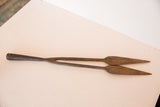 Unique vintage African iron double-headed spear tip with rustic patina and worn texture.