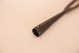 Hollow base and rustic texture of the vintage African iron spear tip.