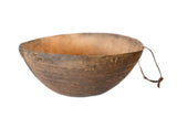 Vintage African hand-carved primitive wooden bowl, rustic brown and worn, with a small loop.