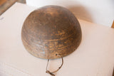 Vintage African wooden bowl's lower section with primitive geometric carvings and a leather cord.