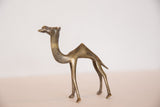 Collectible vintage African bronze camel, showing its unique stylized form and rustic texture.